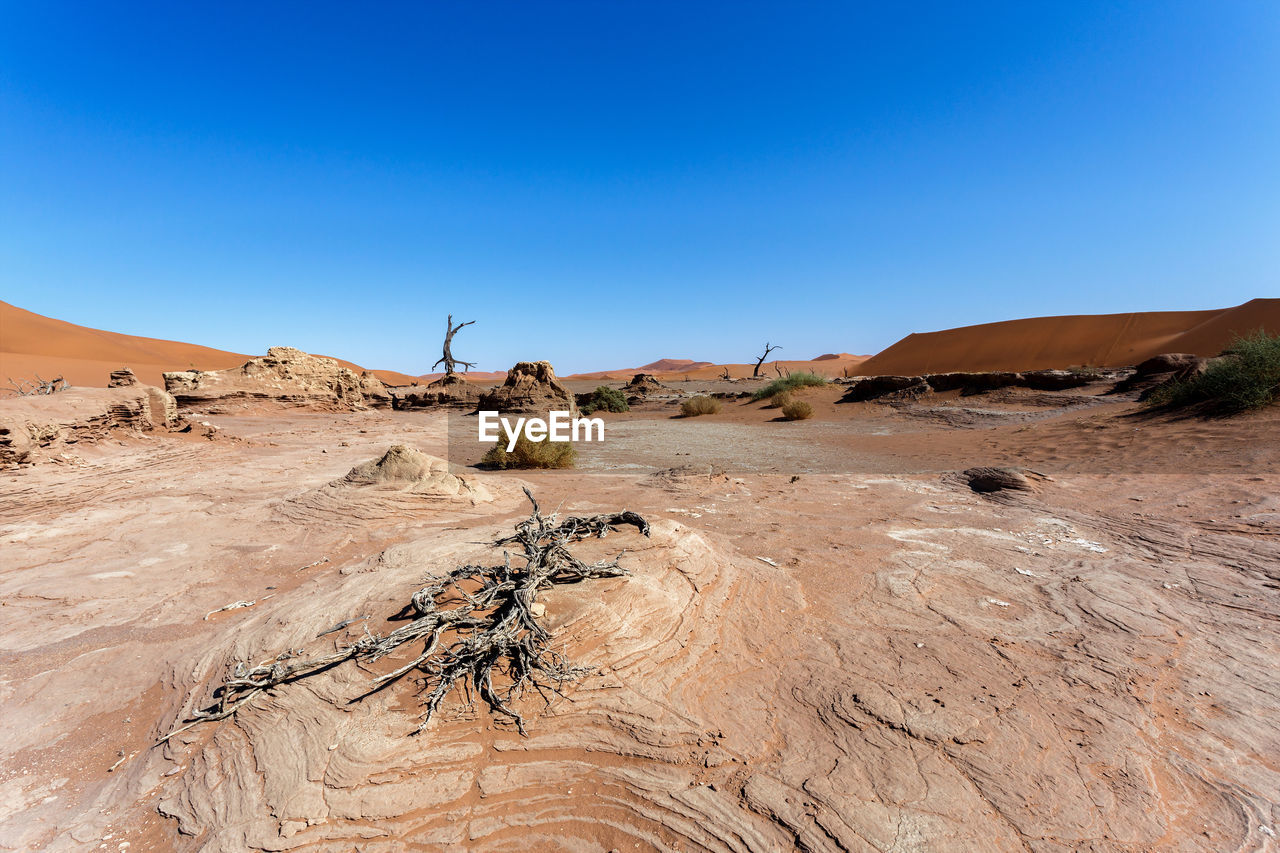 VIEW OF DESERT AGAINST CLEAR BLUE SKY