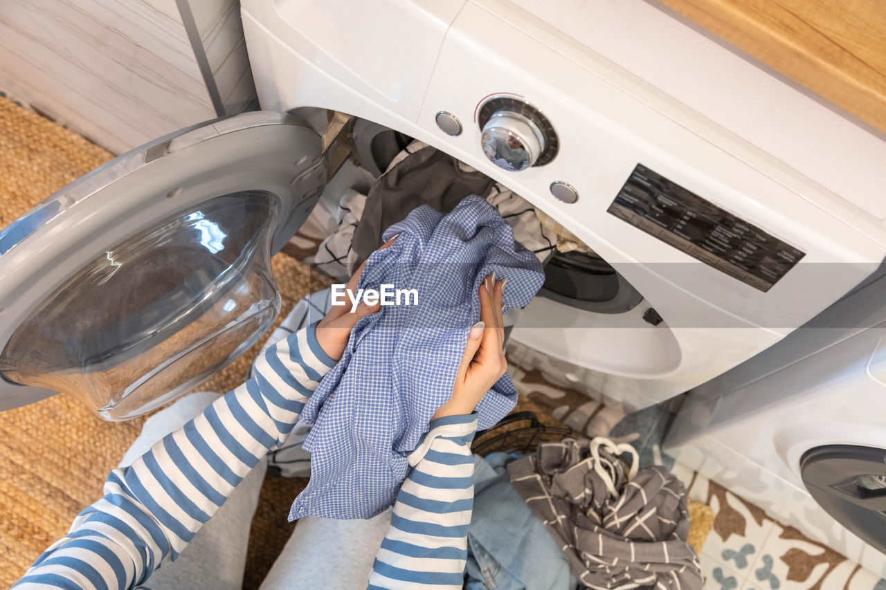 low section of woman washing hands