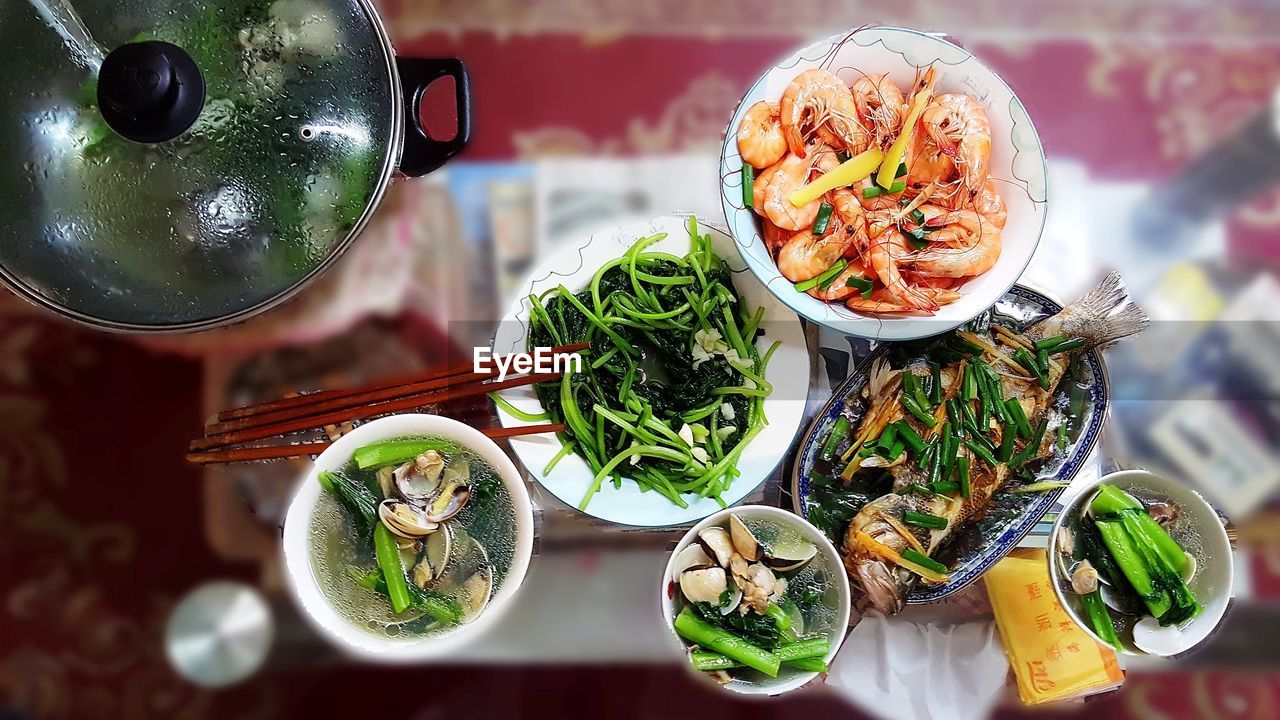 Directly above shot of food served in bowls on table