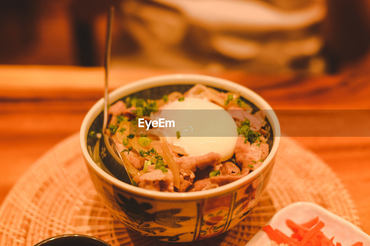 food and drink, food, asian food, healthy eating, bowl, wellbeing, dish, japanese food, meal, freshness, cuisine, soup, no people, vegetable, table, indoors, meat, culture, stew, focus on foreground, chopsticks, close-up, wood, selective focus