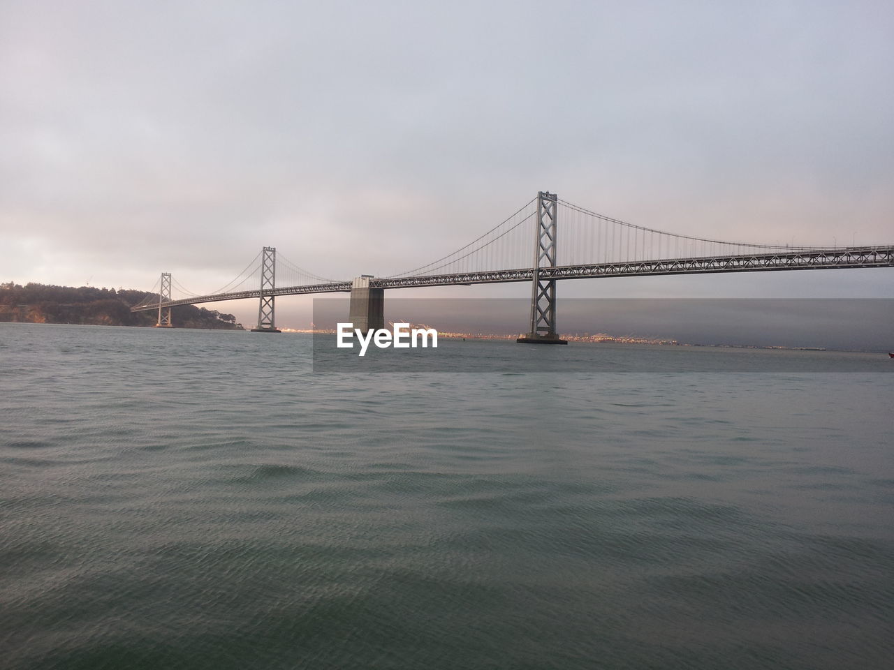 View of suspension bridge over sea