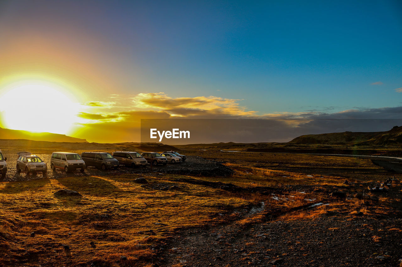 Scenic view of land against sky during sunset