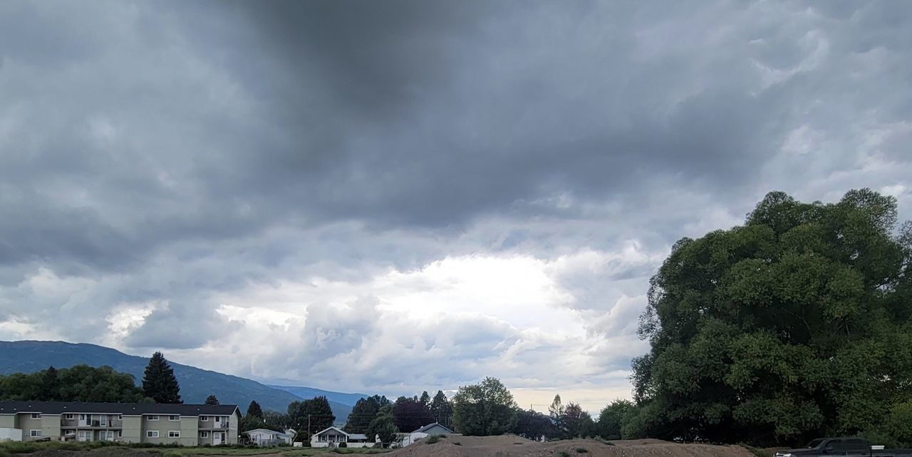 cloud, sky, tree, environment, nature, architecture, plant, landscape, storm, mountain, beauty in nature, building, scenics - nature, no people, rural area, built structure, house, storm cloud, land, travel destinations, travel, dramatic sky, outdoors, water, building exterior, overcast, tourism, cloudscape, road, religion