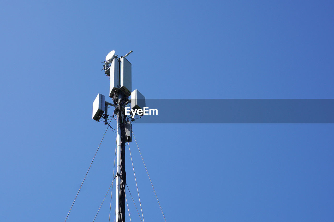 Mobile cell tower against blue sky