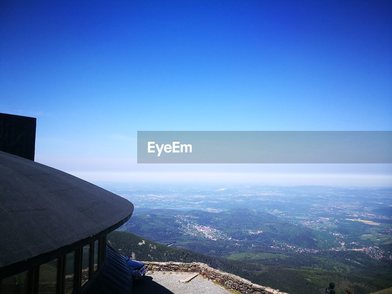 HIGH ANGLE VIEW OF BUILDINGS AGAINST CLEAR SKY