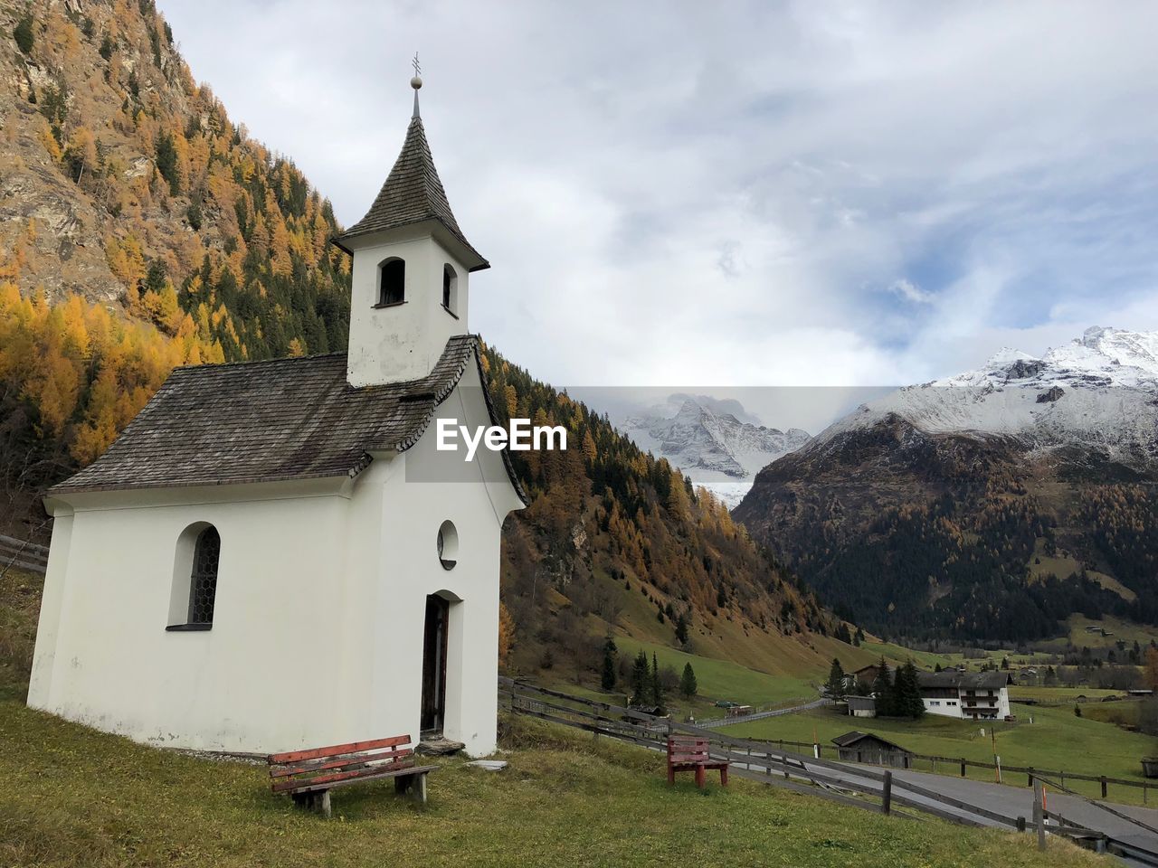 BUILT STRUCTURE ON MOUNTAIN AGAINST SKY