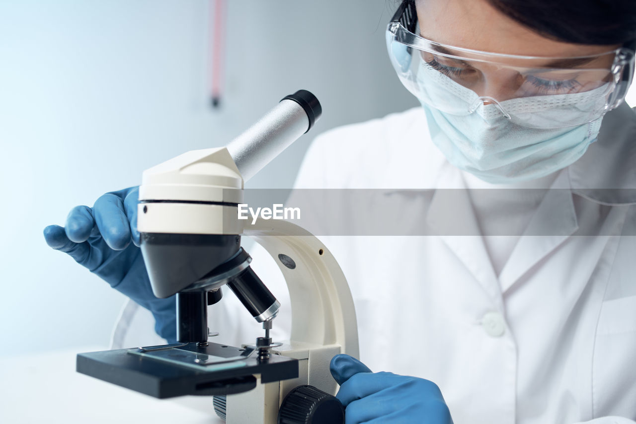 close-up of scientist working on table