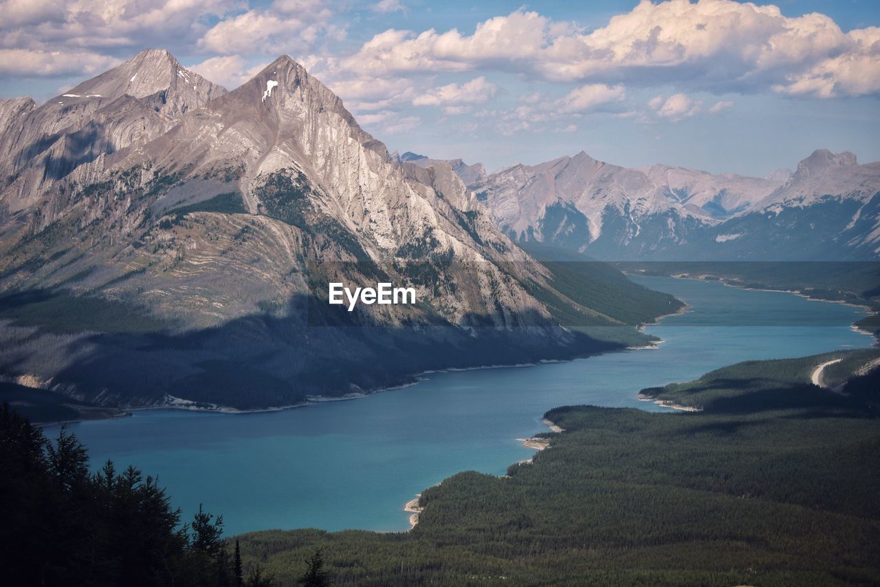 Scenic view of lake and mountains against sky from above