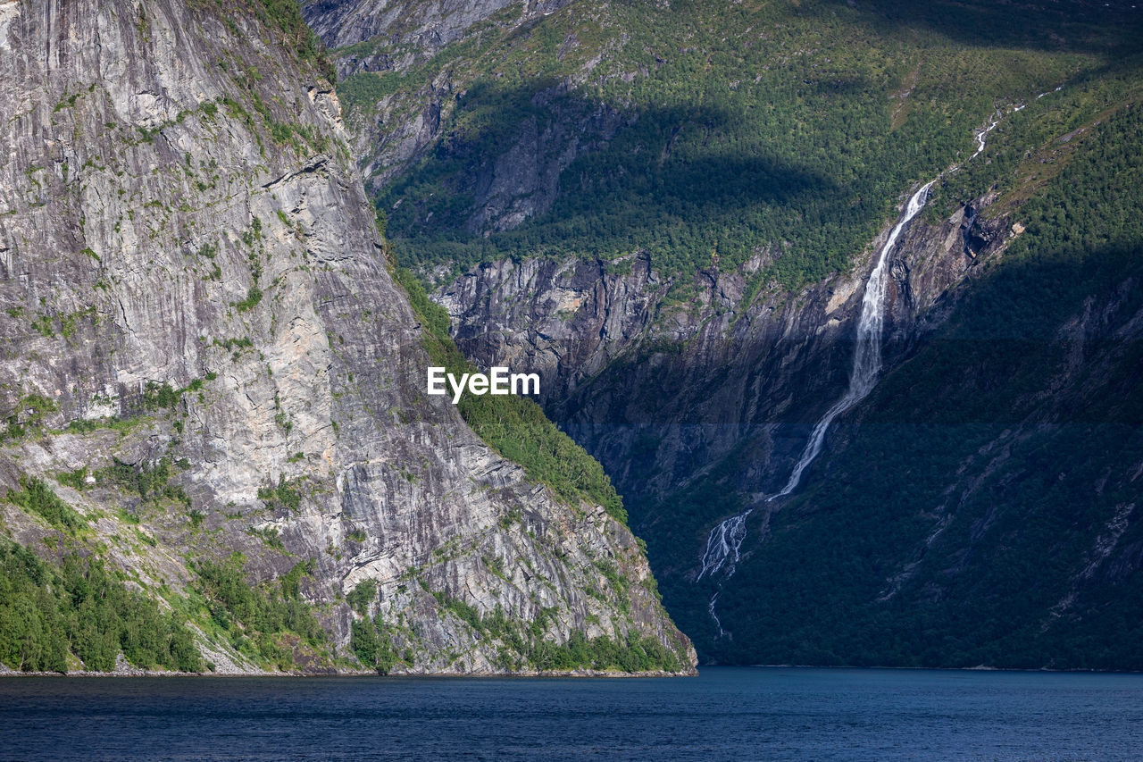 Scenic view of sea against mountains