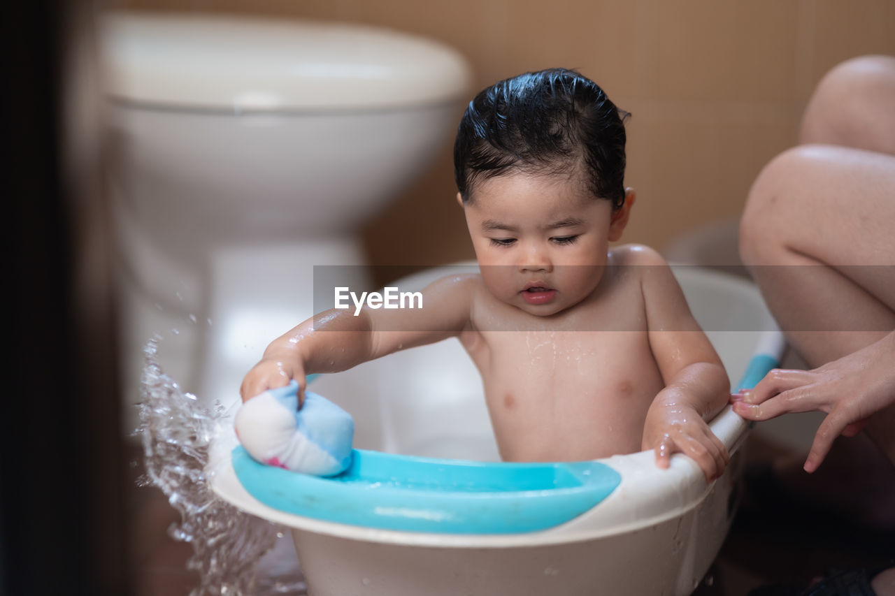 Cute baby boy in bathroom