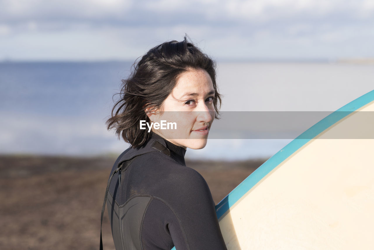 Female surfer with surfboard