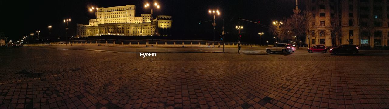 ILLUMINATED CITY BUILDINGS AT NIGHT