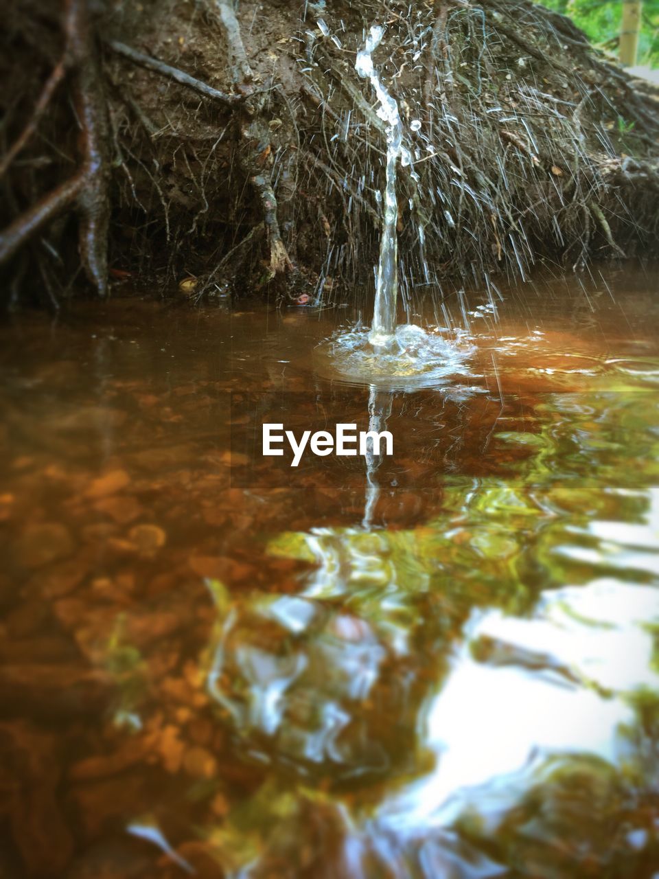 WATER FLOWING THROUGH ROCKS