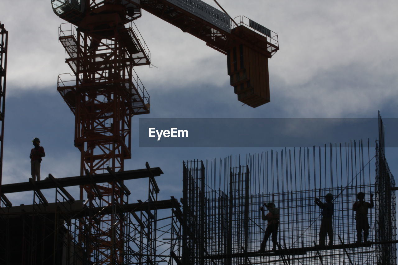 Low angle view of people on construction site