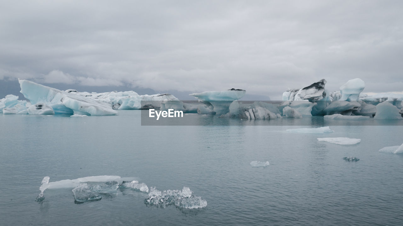 Scenic view of frozen lake against sky