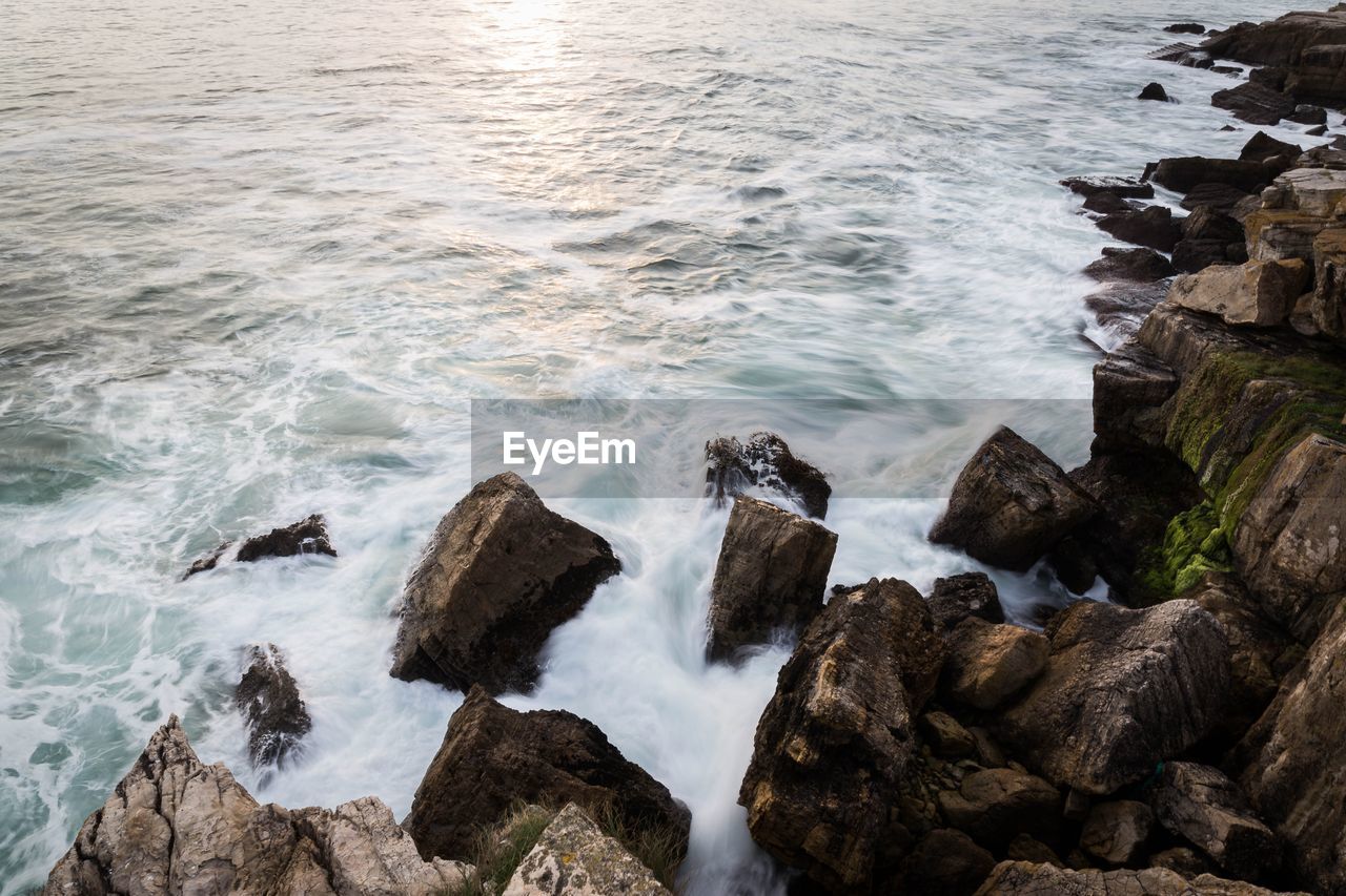 High angle view of rocks in sea