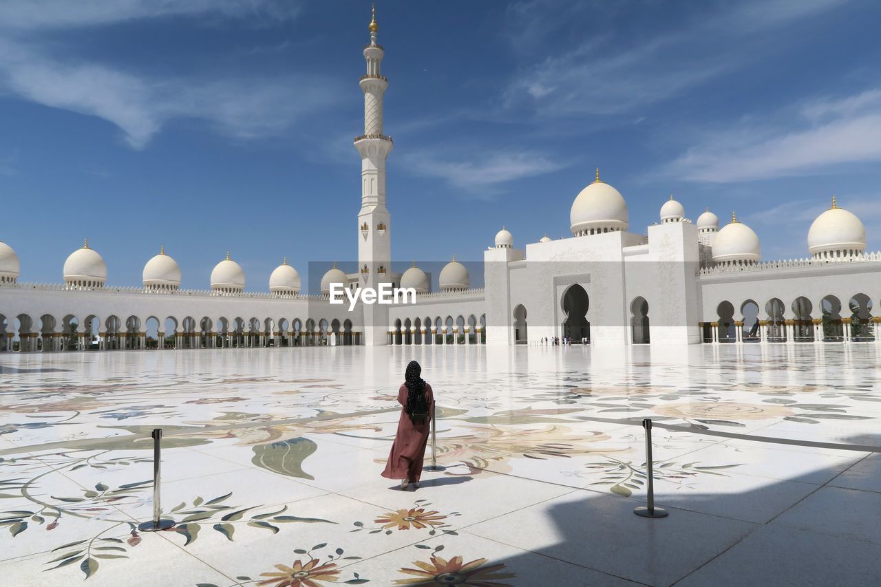 WOMAN VISITING TEMPLE