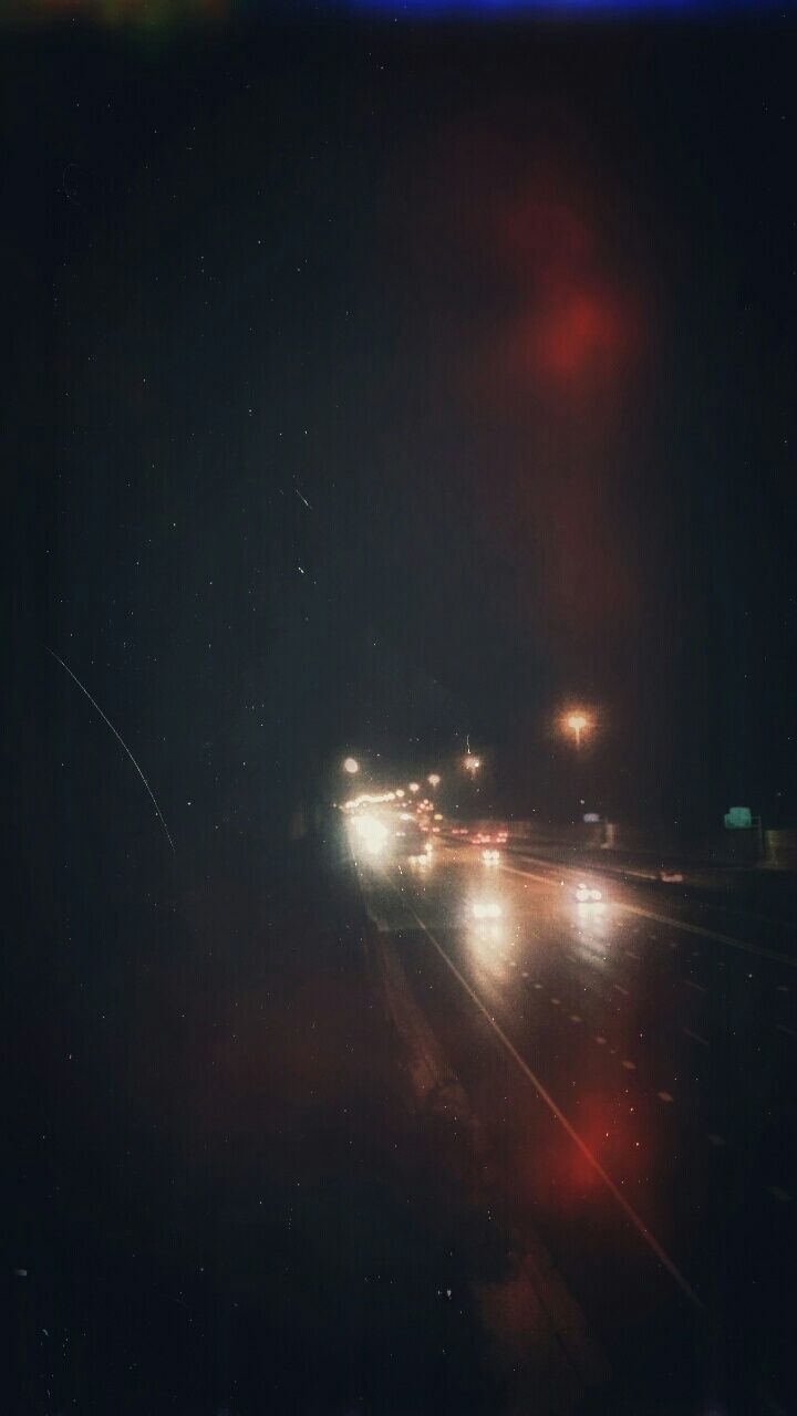 ROAD PASSING THROUGH ILLUMINATED LIGHTS