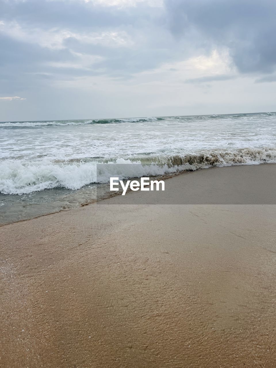 sea, land, beach, water, sky, sand, cloud, body of water, beauty in nature, scenics - nature, wave, nature, wind wave, horizon over water, motion, horizon, shore, tranquility, sports, ocean, surfing, water sports, water's edge, tranquil scene, coast, environment, day, outdoors, coastline, travel destinations, idyllic, holiday, landscape, trip, seascape, travel, vacation, wet