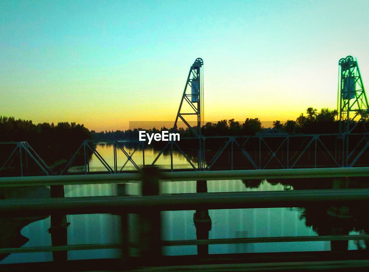 connection, bridge - man made structure, built structure, sunset, architecture, no people, sky, outdoors, industry, silhouette, clear sky, tree, water, day, nature