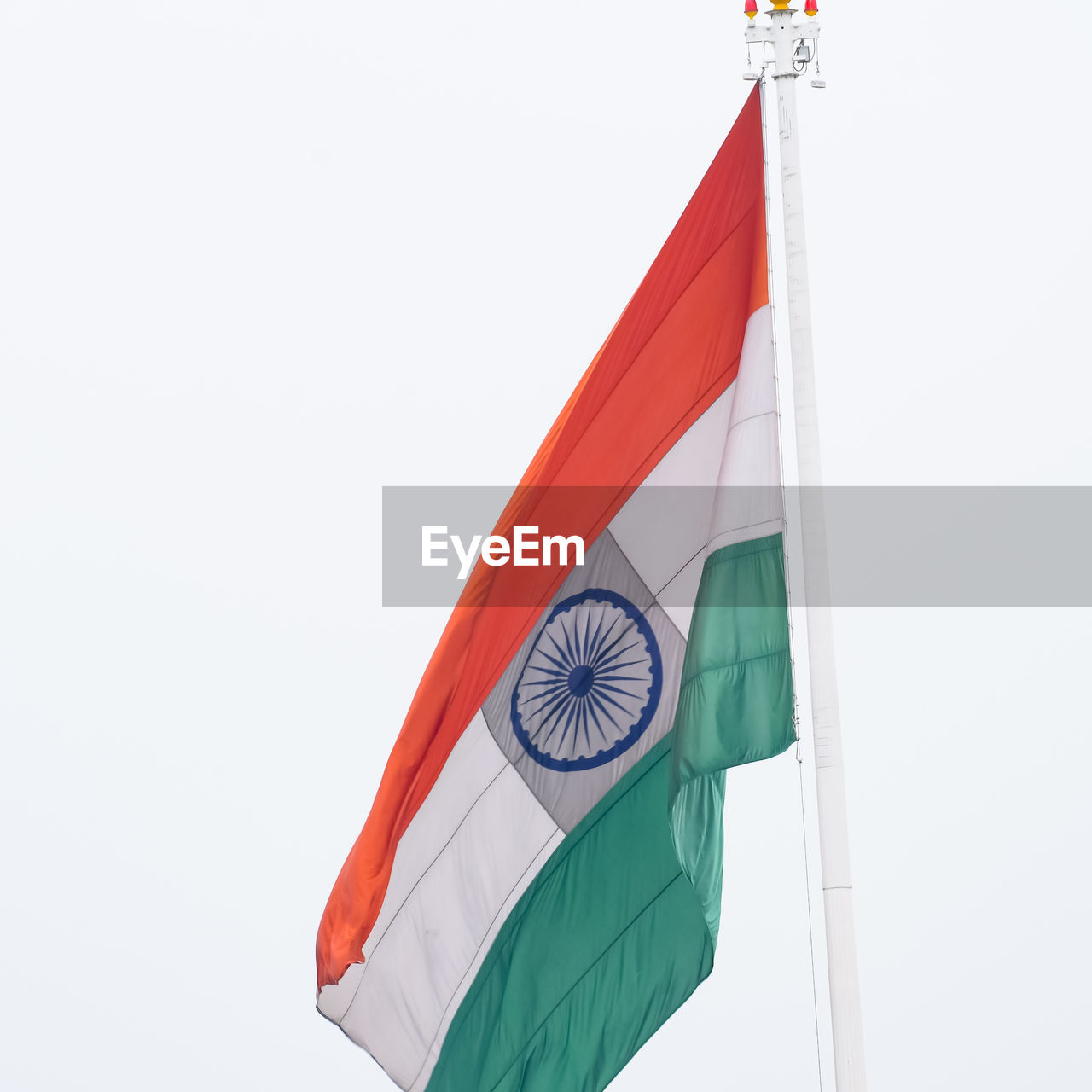 flag, patriotism, no people, low angle view, environment, red, wind, nature, copy space, sky, day, white, outdoors