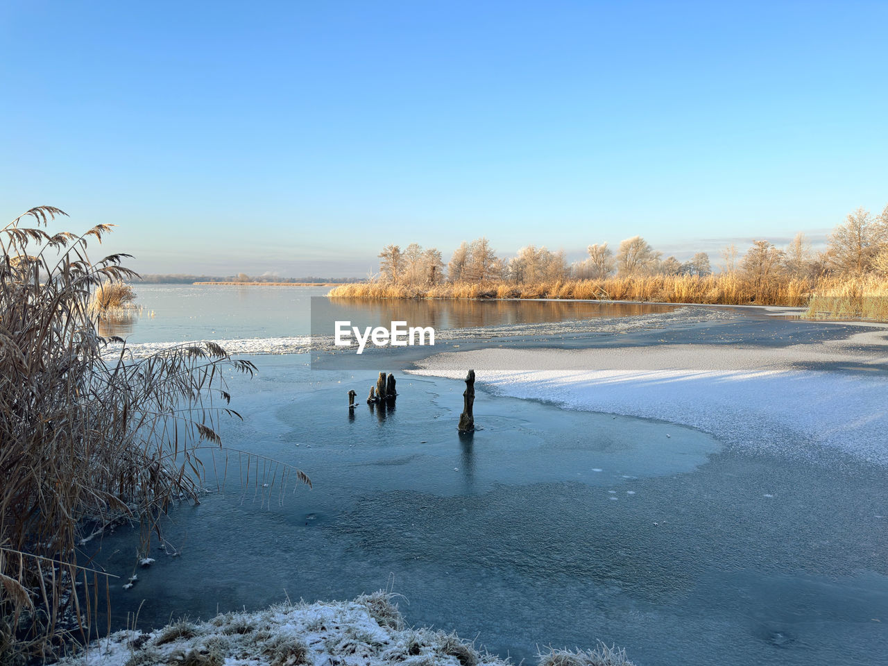 Scenic view of frozen sea in winter against clear sky