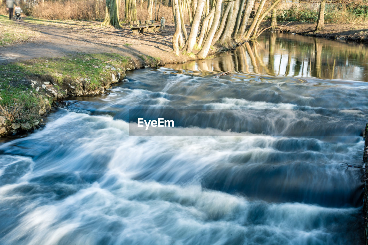 Scenic view of river stream flowing through rocks