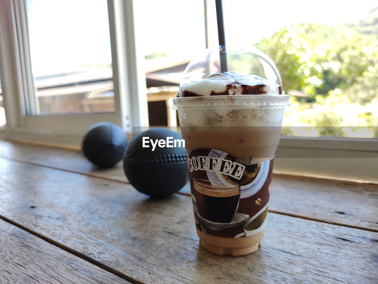 CLOSE-UP OF COFFEE AND DRINK ON TABLE