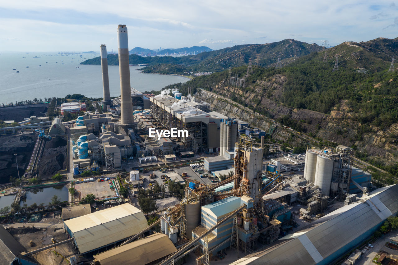 Aerial view of factory against sky