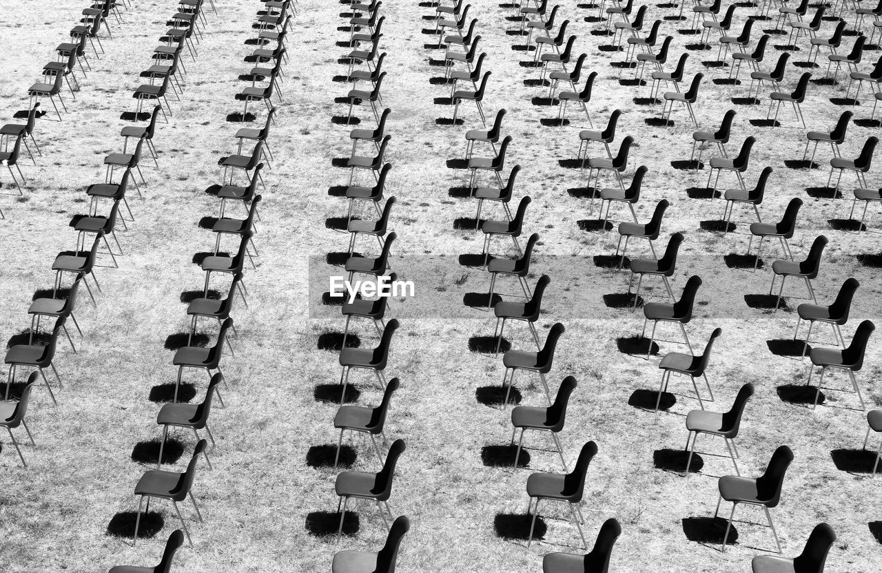Top view of a series of chairs in a row inside the roman amphitheater of sutri 