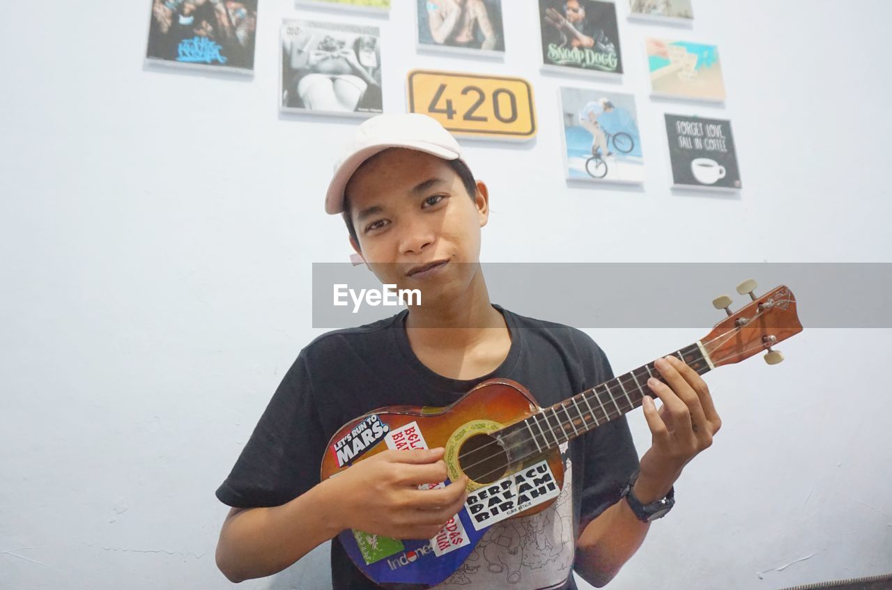 YOUNG MAN PLAYING GUITAR