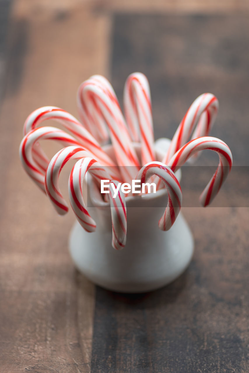 Candy canes in jar holiday background