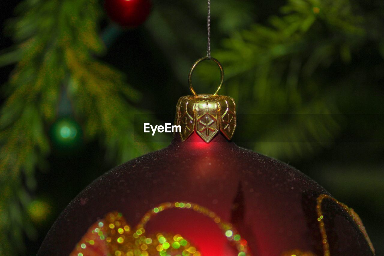 Close-up of bauble hanging on christmas tree