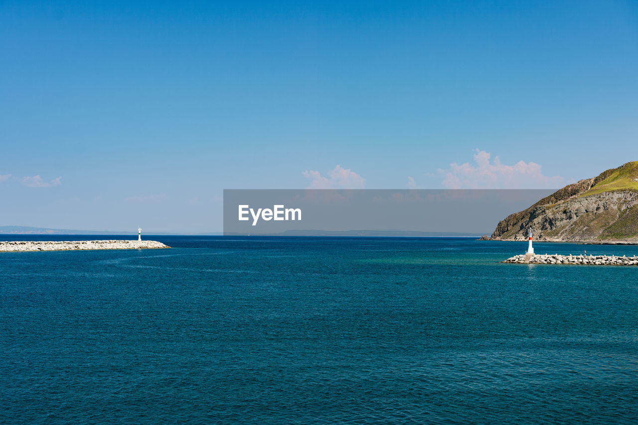 Scenic view of sea against blue sky