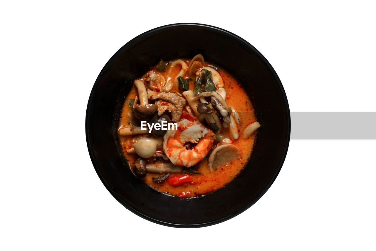 HIGH ANGLE VIEW OF FRESH SOUP IN BOWL ON WHITE BACKGROUND