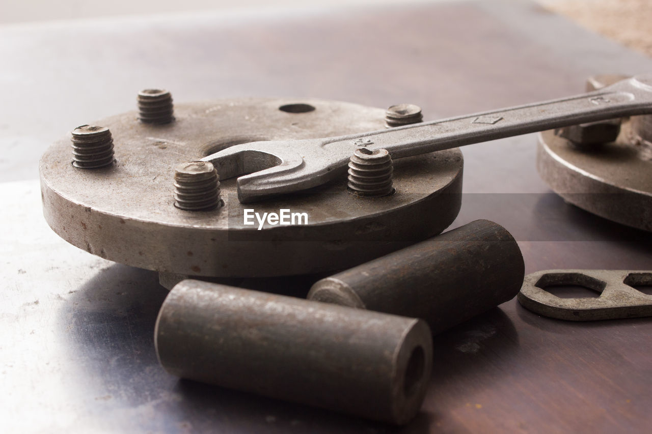 Old hand tools ,pliers screwdriver wrench rusted iron metal tools on steel plate at garage