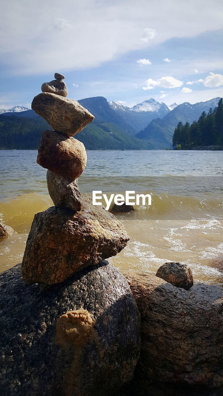 STACK OF ROCKS ON SHORE