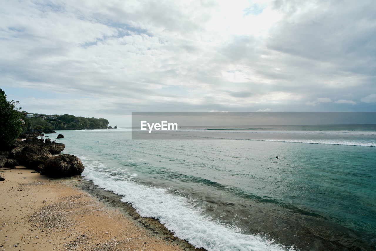 sea, water, land, beach, sky, body of water, cloud, scenics - nature, beauty in nature, ocean, shore, wave, nature, horizon, sand, wind wave, tranquility, coast, environment, coastline, tranquil scene, travel destinations, horizon over water, motion, travel, landscape, vacation, no people, idyllic, outdoors, day, tree, holiday, sports, seascape, trip, tourism, water's edge, water sports, island, bay, rock, non-urban scene, plant, summer, blue, tropical climate