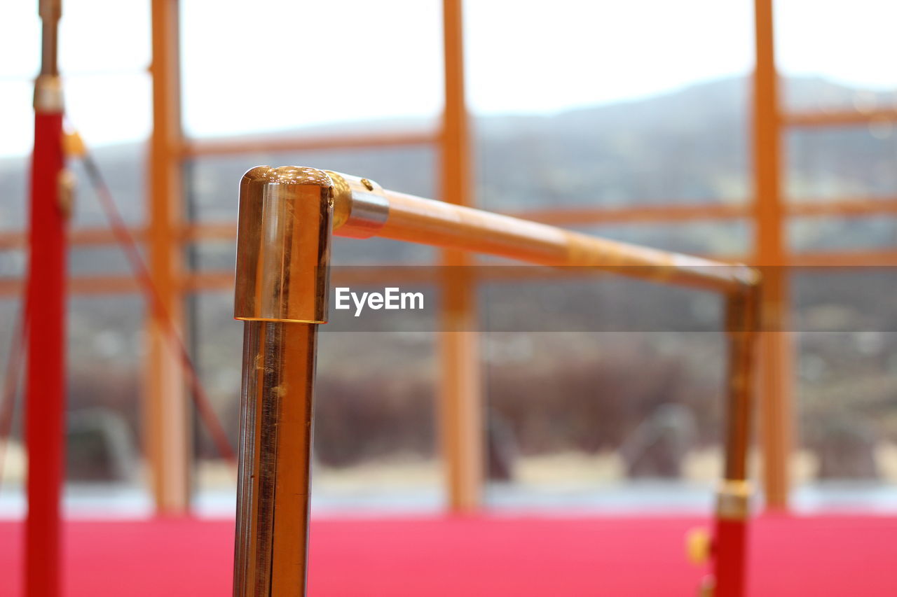 CLOSE-UP OF RUSTY METAL RAILING