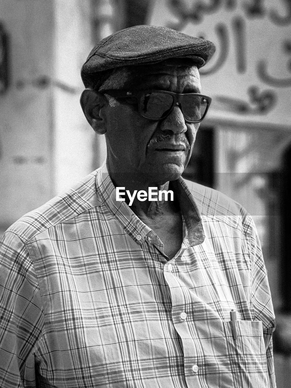 Portrait of old man wearing hat