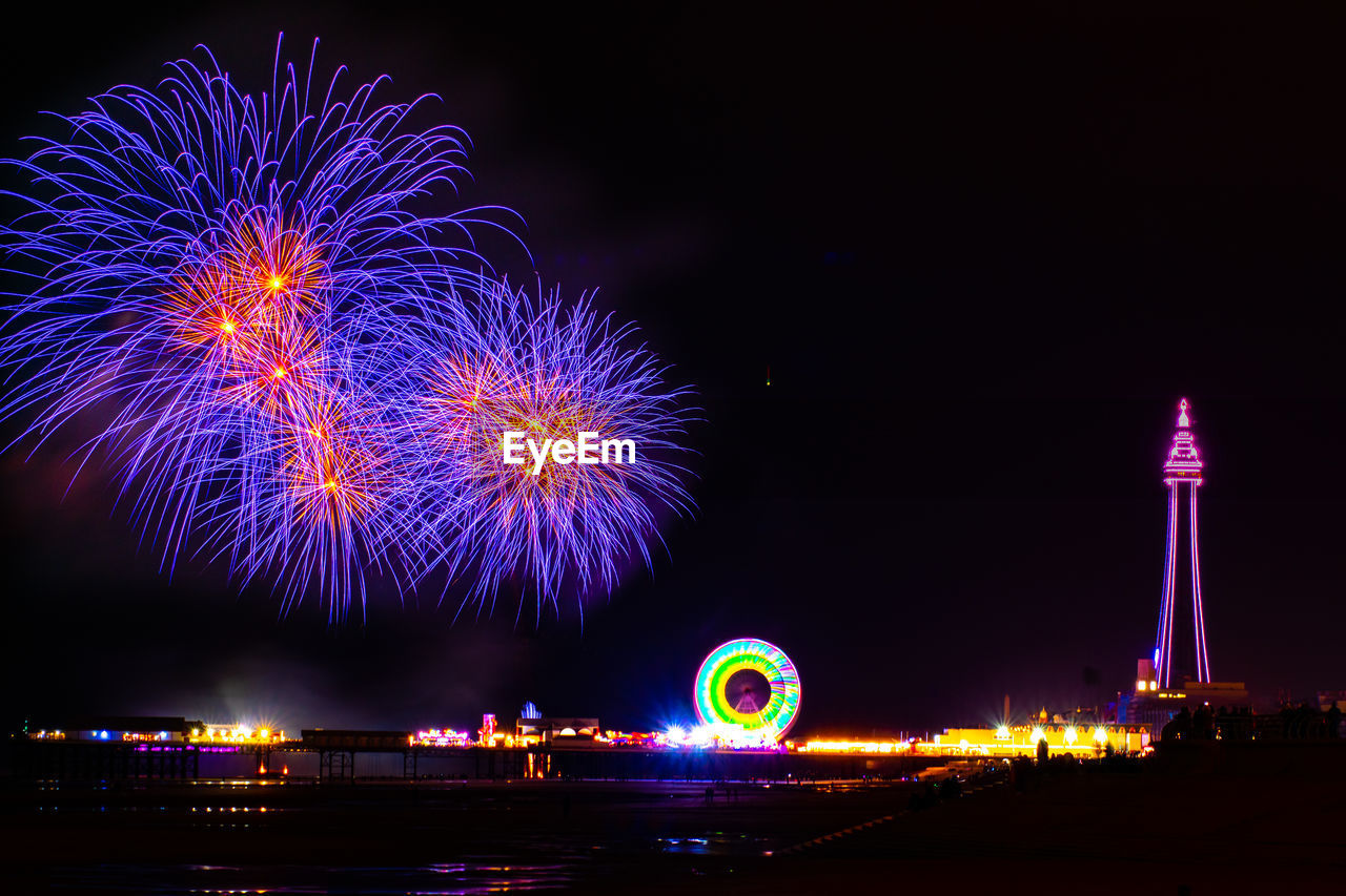 Firework display at night