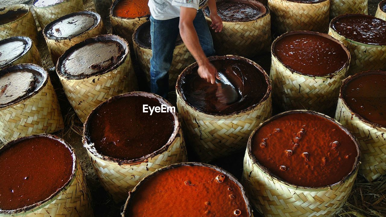 Midsection of man making brown sugar