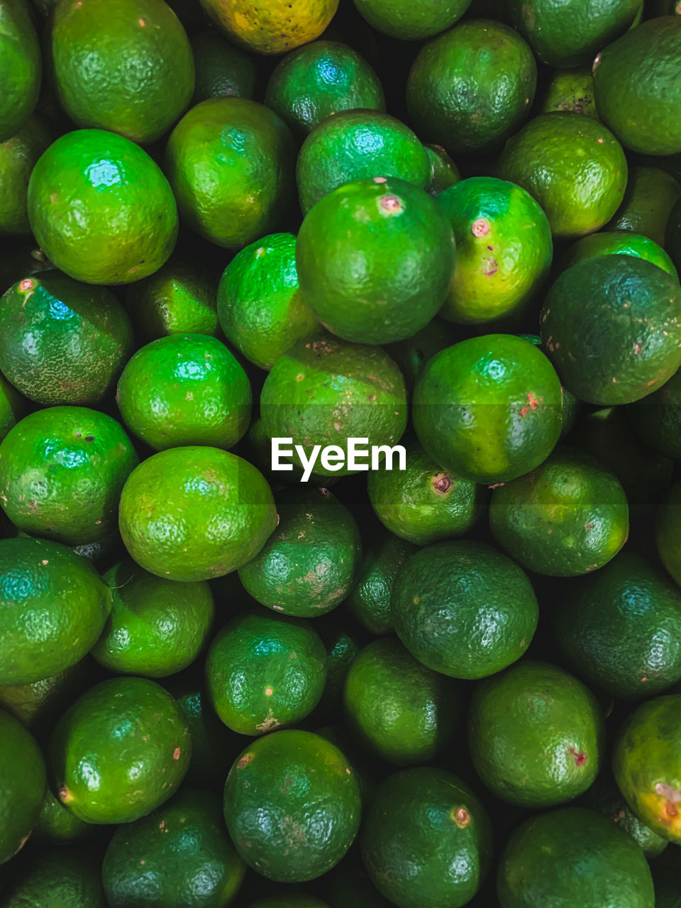 green, food and drink, citrus, food, healthy eating, lime, full frame, freshness, backgrounds, abundance, fruit, large group of objects, wellbeing, plant, calamondin, lemon, produce, no people, citrus fruit, still life, close-up, market, indoors, directly above, for sale, bitter orange, repetition, organic, citron