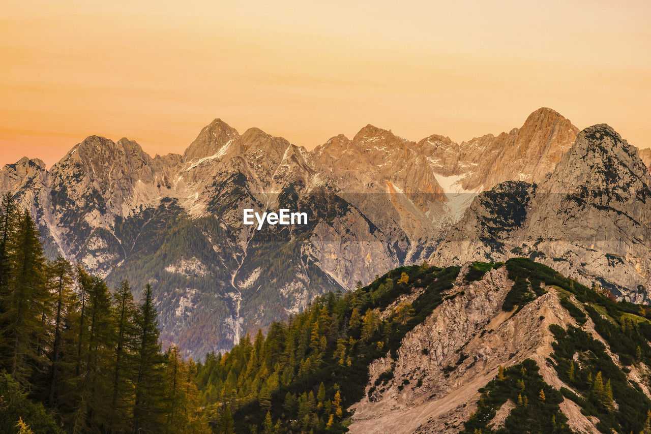 scenic view of snowcapped mountains against sky during sunset