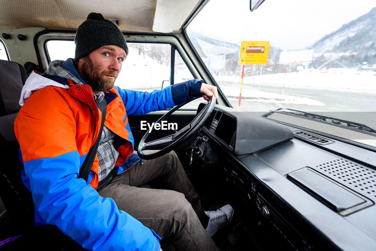 Portrait of man driving truck