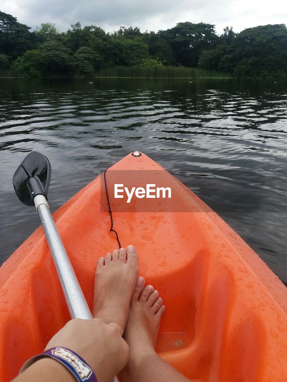 Low section of person in boat on lake