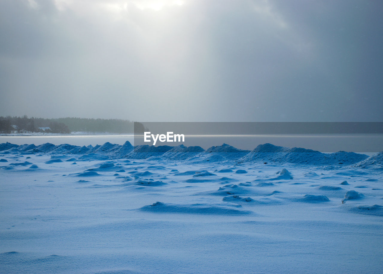 Scenic view of sea against sky during winter