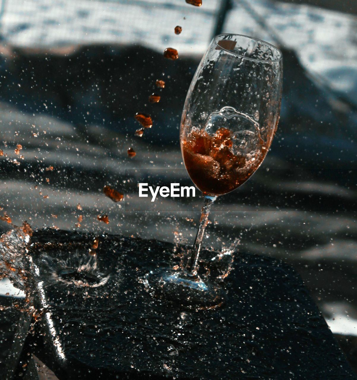 High angle view of drink splashing on table