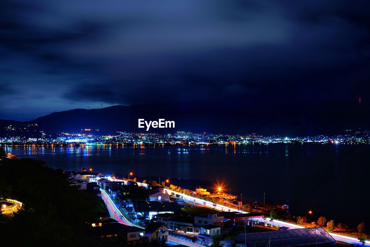 High angle view of illuminated buildings in city at night