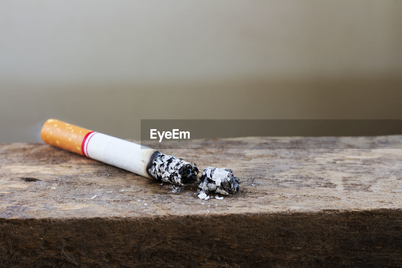 Close up of cigarette on wooden table